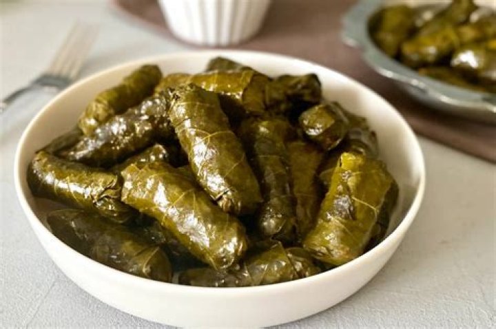 Leaf-wrapped Turkish dish Crossword Clue